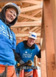 2 people at construction site smiling